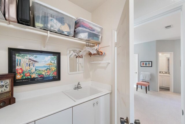 7243 Surfbird Cir, Carlsbad, CA 92011 - bar area featuring a sink and carpet