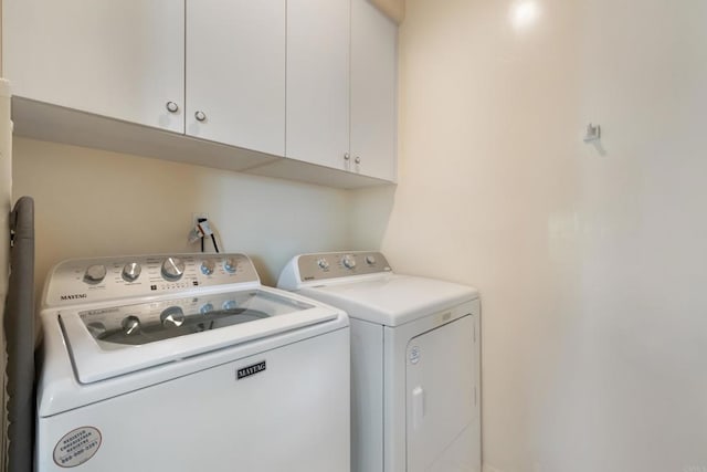 7243 Surfbird Cir, Carlsbad, CA 92011 - laundry room featuring cabinet space and washing machine and dryer