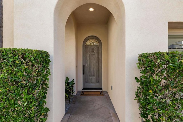 7243 Surfbird Cir, Carlsbad, CA 92011 - doorway to property featuring stucco siding