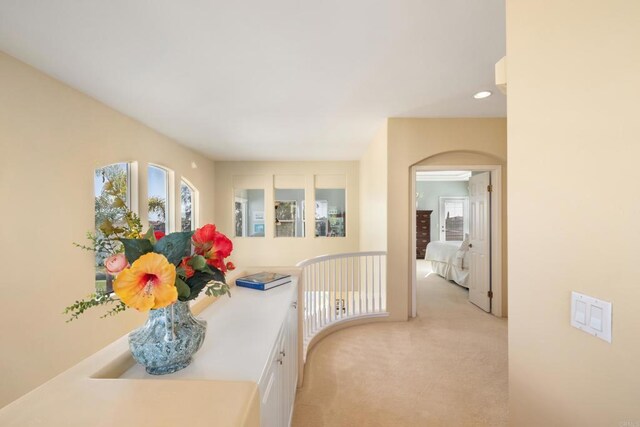 7243 Surfbird Cir, Carlsbad, CA 92011 - corridor with light colored carpet, arched walkways, and recessed lighting