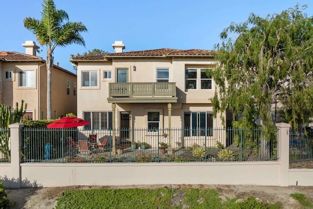 7243 Surfbird Cir, Carlsbad, CA 92011 - back of house featuring a balcony, stucco siding, and a tile roof