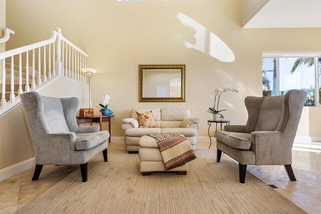7243 Surfbird Cir, Carlsbad, CA 92011 - living room featuring a high ceiling and stairs