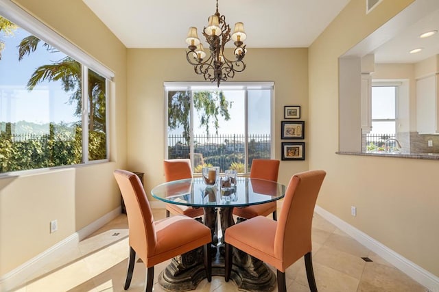 7243 Surfbird Cir, Carlsbad, CA 92011 - dining space with plenty of natural light, a chandelier, light tile patterned floors, and recessed lighting