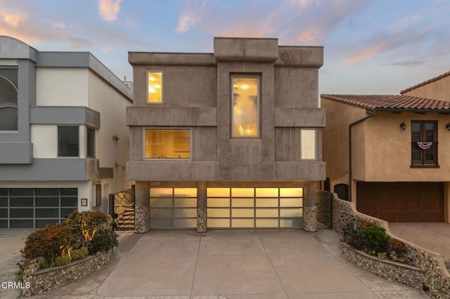 3629 Ocean Dr, Oxnard, CA 93035 - view of front of home with a garage, stucco siding, and concrete driveway