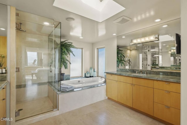 3629 Ocean Dr, Oxnard, CA 93035 - full bath with vanity, a stall shower, a garden tub, recessed lighting, and tile patterned floors