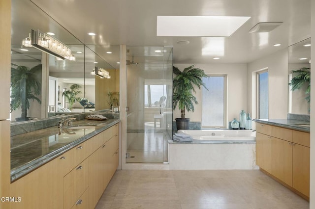 3629 Ocean Dr, Oxnard, CA 93035 - bathroom featuring a stall shower, vanity, a garden tub, and recessed lighting