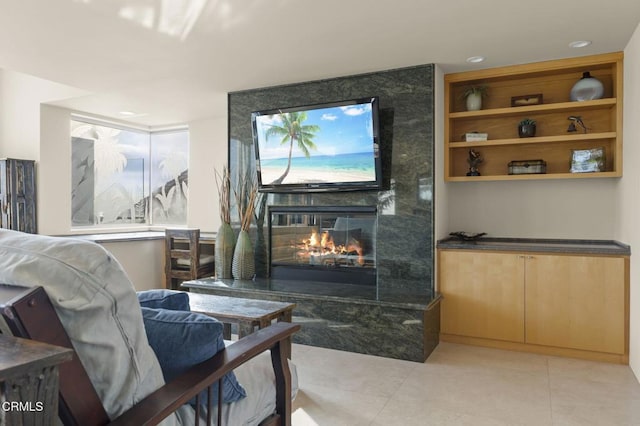 3629 Ocean Dr, Oxnard, CA 93035 - living room with a premium fireplace, light tile patterned floors, and built in features