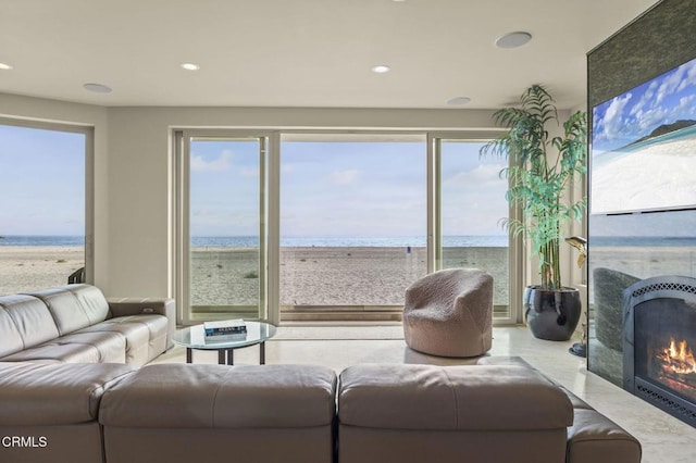 3629 Ocean Dr, Oxnard, CA 93035 - living area featuring a water view, plenty of natural light, recessed lighting, and a high end fireplace