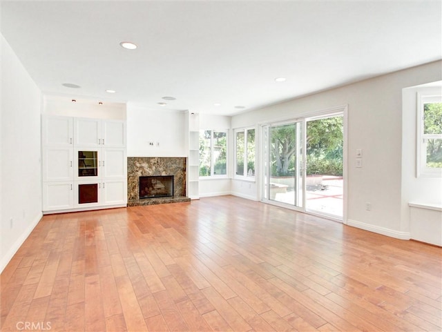 20472 Via Marwah, Yorba Linda, CA 92886 - unfurnished living room featuring light wood finished floors, a premium fireplace, and recessed lighting
