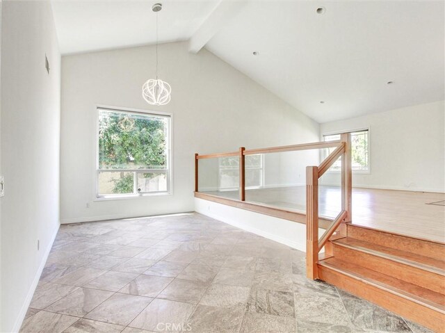 20472 Via Marwah, Yorba Linda, CA 92886 - unfurnished living room with stairs, beam ceiling, a chandelier, stone finish floors, and high vaulted ceiling