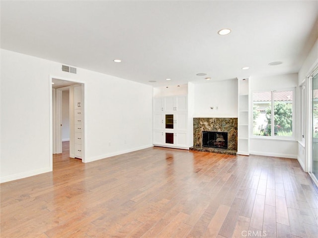 20472 Via Marwah, Yorba Linda, CA 92886 - unfurnished living room featuring light wood-style floors, recessed lighting, and a high end fireplace