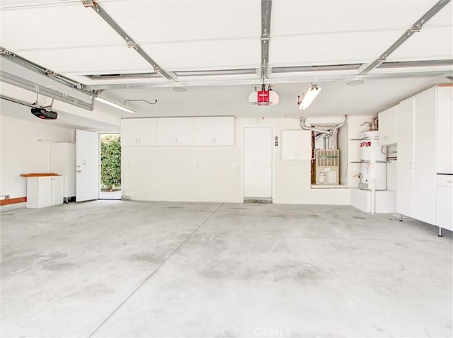 20472 Via Marwah, Yorba Linda, CA 92886 - garage featuring a garage door opener, strapped water heater, and heating unit