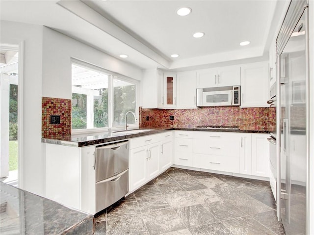 20472 Via Marwah, Yorba Linda, CA 92886 - kitchen featuring stainless steel appliances, recessed lighting, dark stone countertops, white cabinets, and backsplash