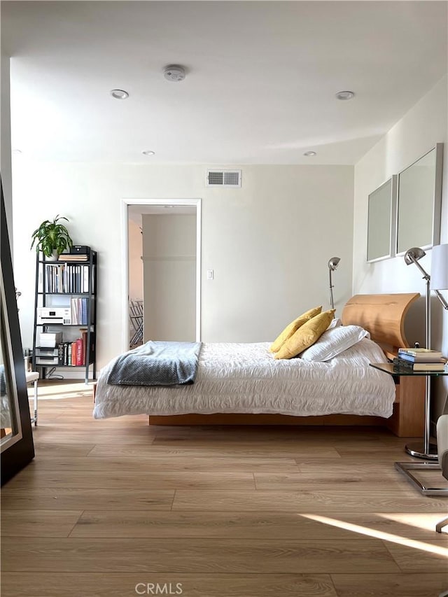 3407 Huxley St Unit 39, Los Angeles, CA 90027 - bedroom featuring wood finished floors and recessed lighting