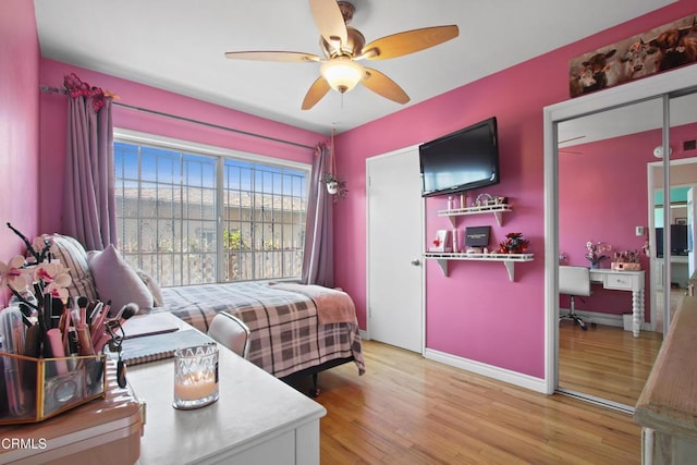 2165 W 115th St, Hawthorne, CA 90250 - bedroom with light wood finished floors, a ceiling fan, and a desk