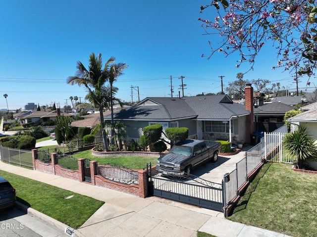 2165 W 115th St, Hawthorne, CA 90250 - view of front facade featuring a gate, a fenced front yard, and a residential view