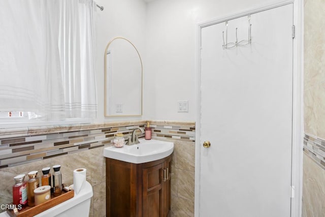 2165 W 115th St, Hawthorne, CA 90250 - half bathroom with tile walls, vanity, and a wainscoted wall