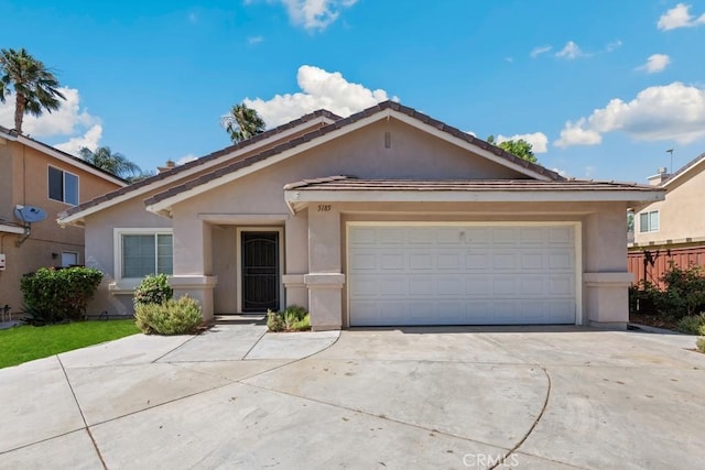 5185 Konic Ct, Riverside, CA 92509 - ranch-style home featuring stucco siding, concrete driveway, and an attached garage