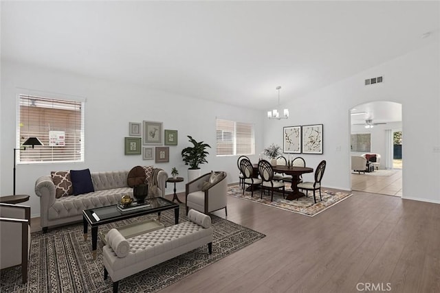 5185 Konic Ct, Riverside, CA 92509 - living area with a ceiling fan, a chandelier, wood finished floors, and healthy amount of natural light