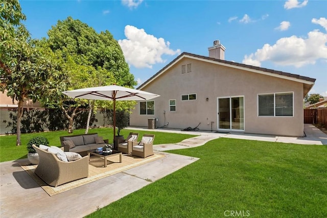 5185 Konic Ct, Riverside, CA 92509 - back of property featuring an outdoor living space, a fenced backyard, a patio area, a chimney, and stucco siding