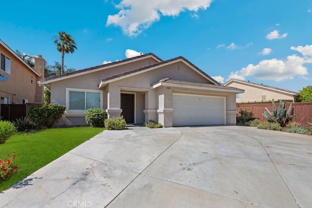 5185 Konic Ct, Riverside, CA 92509 - ranch-style house with stucco siding, a garage, and driveway