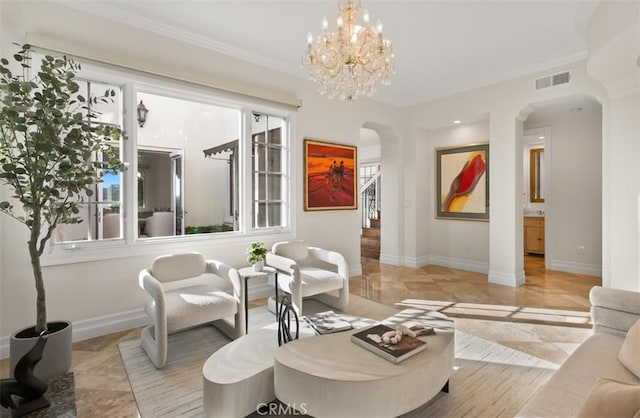 3 Atlantis Cv, Newport Coast, CA 92657 - living area with arched walkways, crown molding, and a chandelier