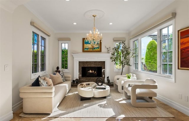 3 Atlantis Cv, Newport Coast, CA 92657 - living area with ornamental molding, a chandelier, recessed lighting, and a high end fireplace