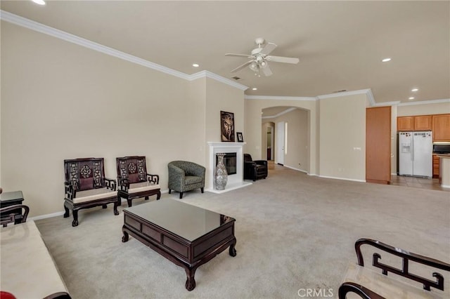 1708 Snowberry Rd, Beaumont, CA 92223 - living area featuring arched walkways, ceiling fan, light colored carpet, recessed lighting, and crown molding