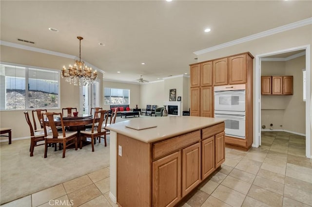 1708 Snowberry Rd, Beaumont, CA 92223 - kitchen with double oven, recessed lighting, light carpet, light tile patterned floors, and crown molding
