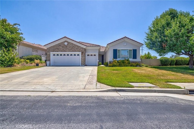 1708 Snowberry Rd, Beaumont, CA 92223 - view of front of house with a garage, a tiled roof, driveway, and stucco siding