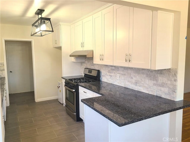 12817 Larwin Rd, Norwalk, CA 90650 - kitchen with stainless steel gas stove, under cabinet range hood, white cabinets, and decorative backsplash