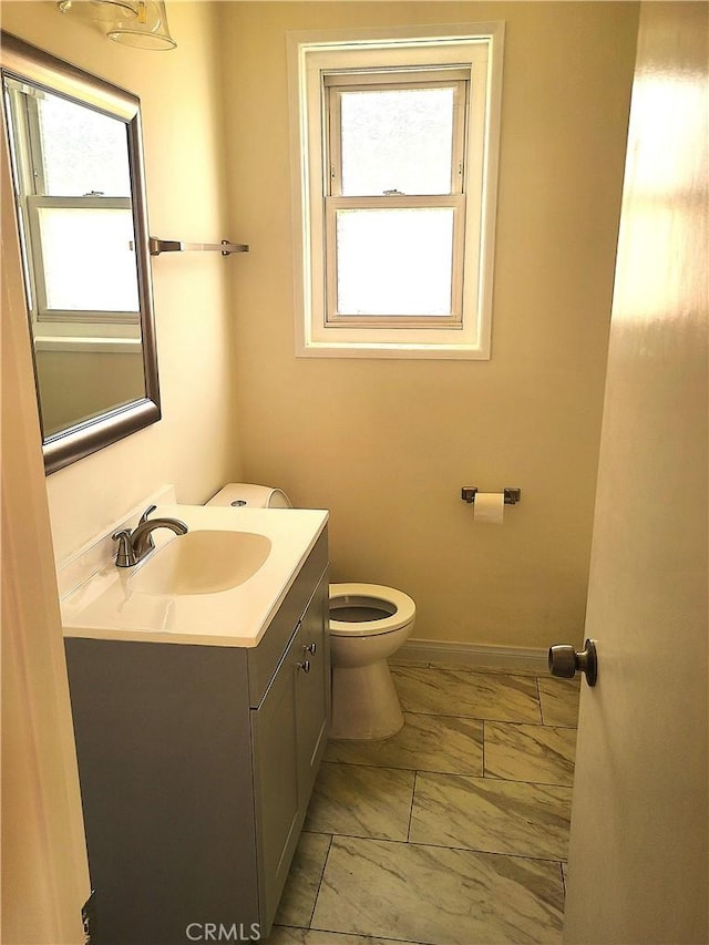 12817 Larwin Rd, Norwalk, CA 90650 - bathroom featuring vanity, marble finish floors, and plenty of natural light