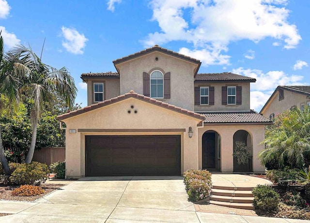 10511 Monterey Ridge Dr, San Diego, CA 92127 - mediterranean / spanish-style home featuring a tile roof, concrete driveway, stucco siding, and a garage