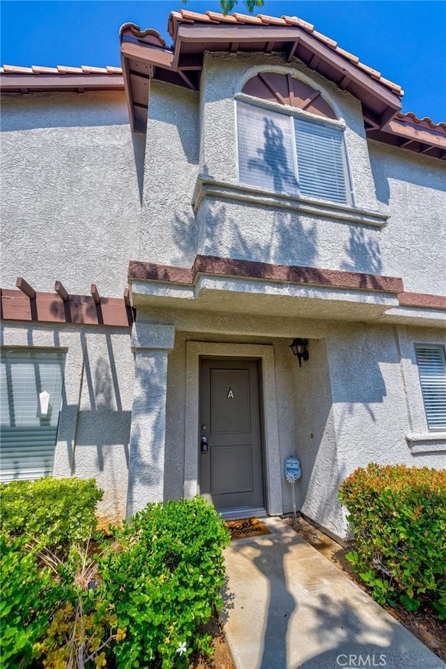 24232 Sylvan Glen Rd Unit A, Diamond Bar, CA 91765 - view of exterior entry featuring stucco siding and a tiled roof