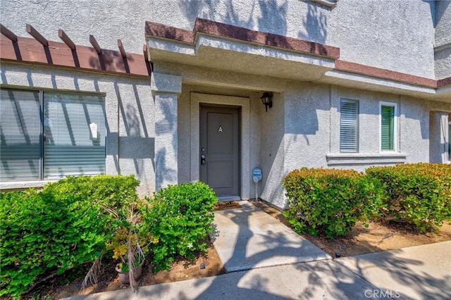 24232 Sylvan Glen Rd Unit A, Diamond Bar, CA 91765 - doorway to property featuring stucco siding