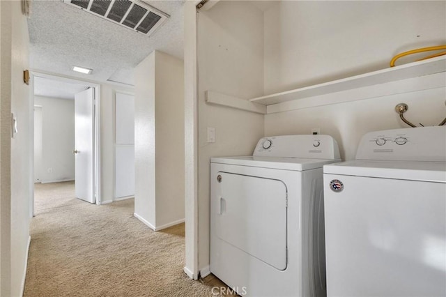 24232 Sylvan Glen Rd Unit A, Diamond Bar, CA 91765 - washroom with light carpet, washing machine and clothes dryer, and a textured ceiling