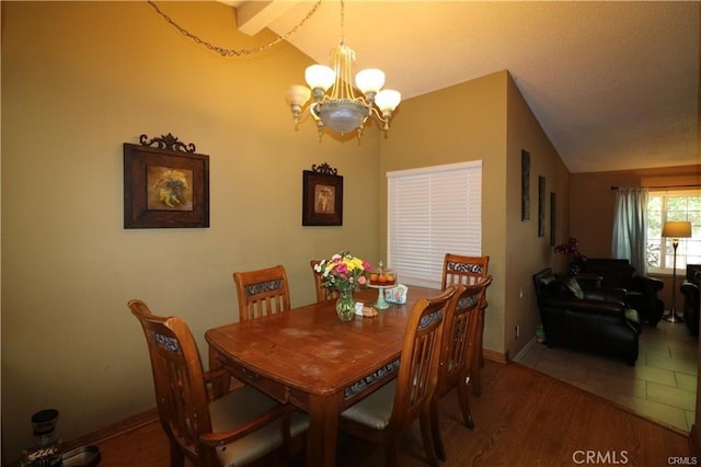 4537 Elwood Ave, Palmdale, CA 93552 - dining room with a chandelier, vaulted ceiling, and wood finished floors