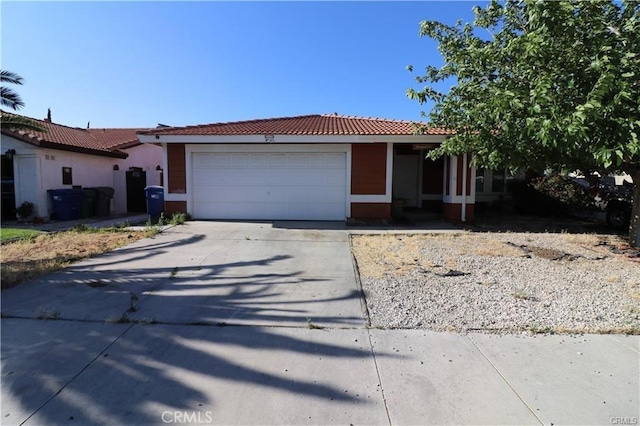 4537 Elwood Ave, Palmdale, CA 93552 - ranch-style home with a tiled roof, driveway, and an attached garage