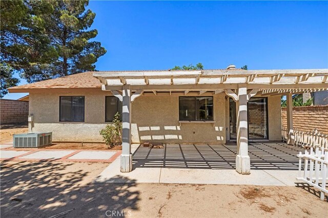 37702 Medea Ct, Palmdale, CA 93550 - back of house featuring stucco siding and a pergola