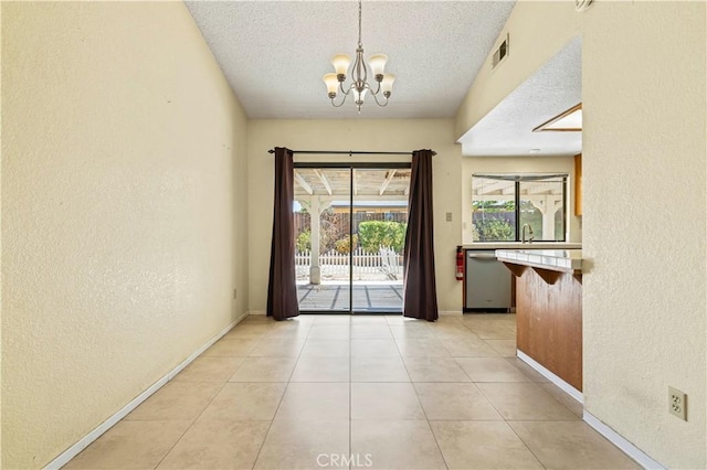 37702 Medea Ct, Palmdale, CA 93550 - entryway with a textured wall, a chandelier, a textured ceiling, and light tile patterned flooring