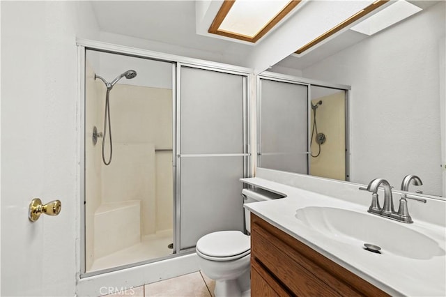 37702 Medea Ct, Palmdale, CA 93550 - full bath with a stall shower, vanity, tile patterned flooring, and a skylight