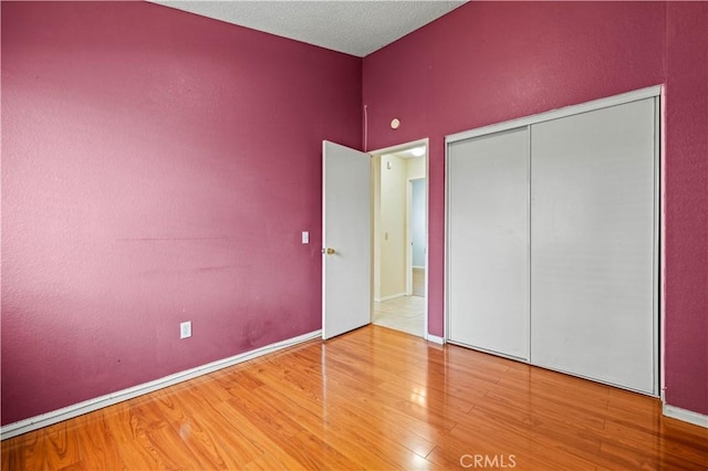 37702 Medea Ct, Palmdale, CA 93550 - unfurnished bedroom featuring wood finished floors and a closet