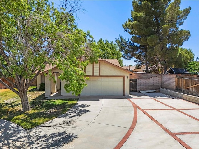 37702 Medea Ct, Palmdale, CA 93550 - view of front facade with driveway, stucco siding, and a garage