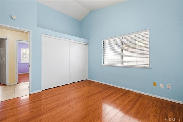 37702 Medea Ct, Palmdale, CA 93550 - unfurnished bedroom featuring vaulted ceiling, wood finished floors, and a closet