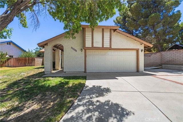 37702 Medea Ct, Palmdale, CA 93550 - view of front of property featuring concrete driveway, a garage, and stucco siding