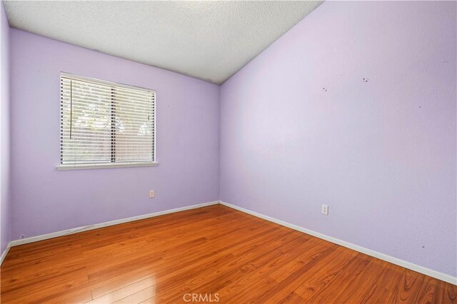 37702 Medea Ct, Palmdale, CA 93550 - unfurnished room featuring light wood-style flooring and a textured ceiling