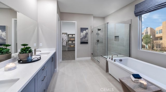 200 Lily Loop, Irvine, CA 92618 - full bath with double vanity, a shower stall, a freestanding tub, and plenty of natural light