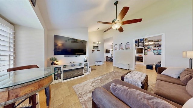 7413 Crimson Dr, Highland, CA 92346 - living area featuring a ceiling fan, high vaulted ceiling, and a chandelier