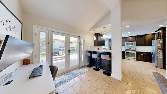 7413 Crimson Dr, Highland, CA 92346 - kitchen featuring stainless steel appliances, french doors, stone tile flooring, dark brown cabinets, and lofted ceiling