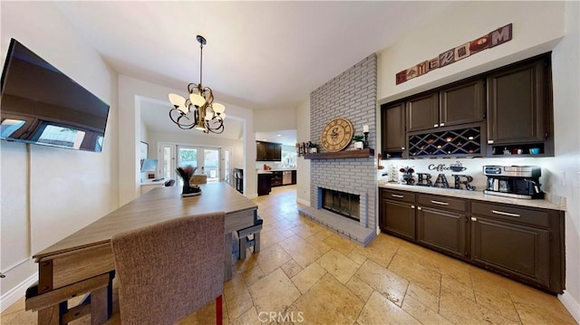 7413 Crimson Dr, Highland, CA 92346 - kitchen featuring dark brown cabinetry, stone tile flooring, light countertops, and open shelves